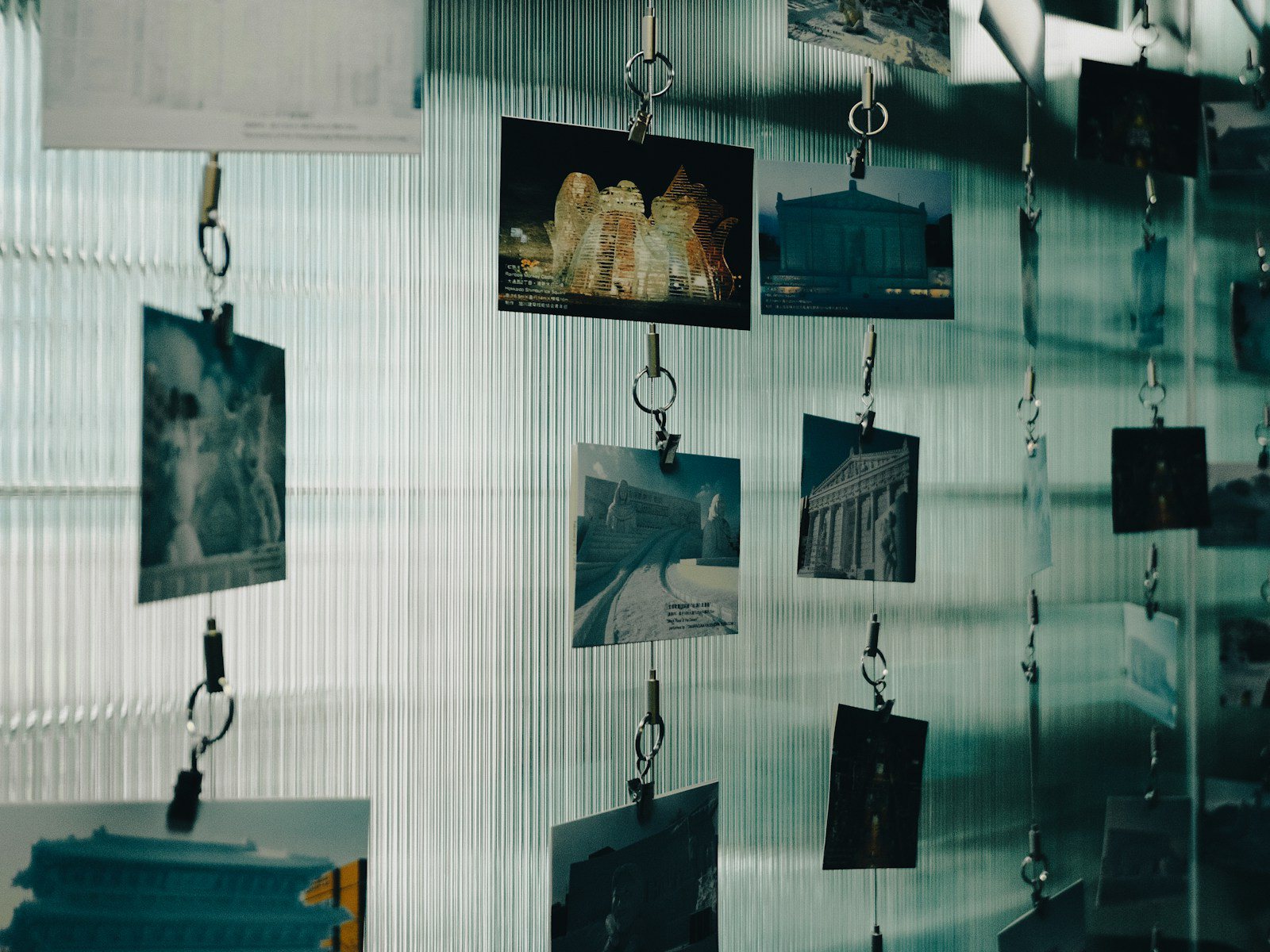 Film strip of neon reflections and rain-wet roads cut into frames on a dark background